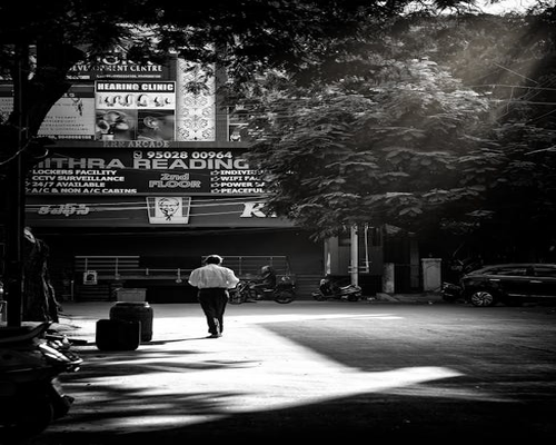 A individual taking a brief light walk during a work break in the city